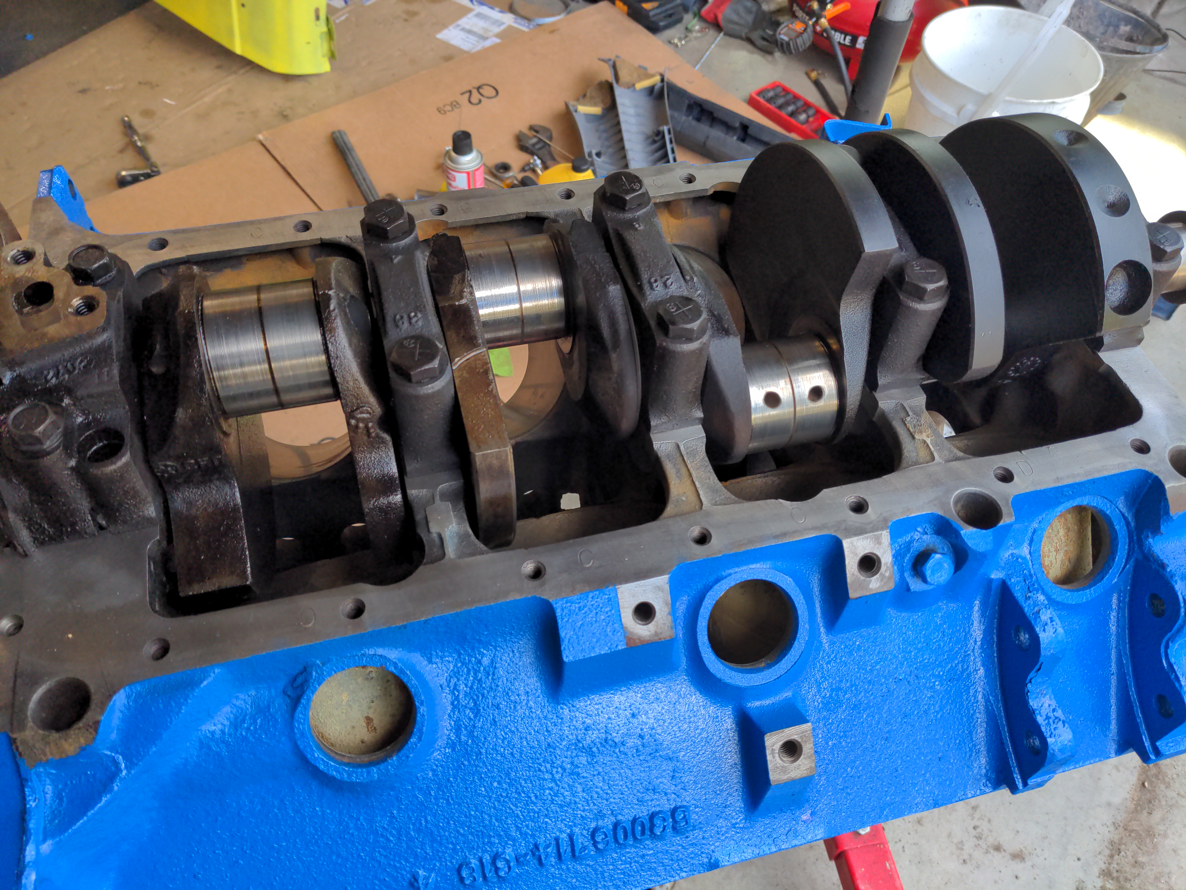 Yet another picture of the same damn V8 engine, but now it's a lot cleaner and it's being assembled. Hooray! The original crankshaft has been installed with new bearings and the pistons and connecting rods have yet to go in.