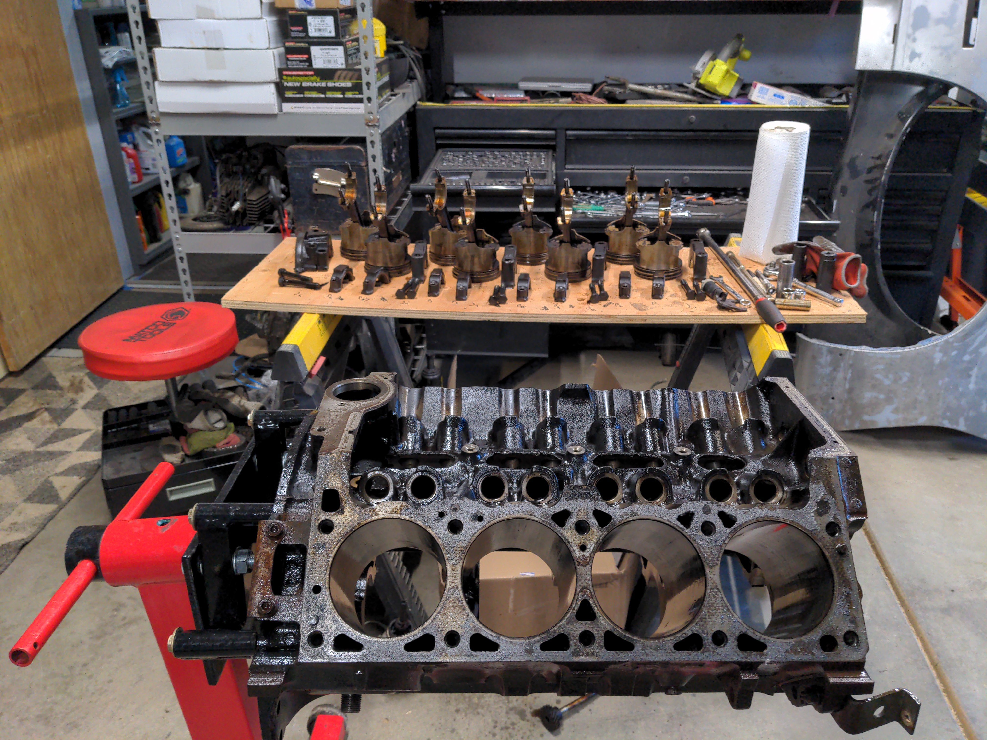 A V8 engine, stripped down to the bare block. There's a lot of rust and corrosion here, but the interior of the engine is very clean. This is good news, and means the block can be reused. Much of the rotating assembly is visible in the background of the picture.