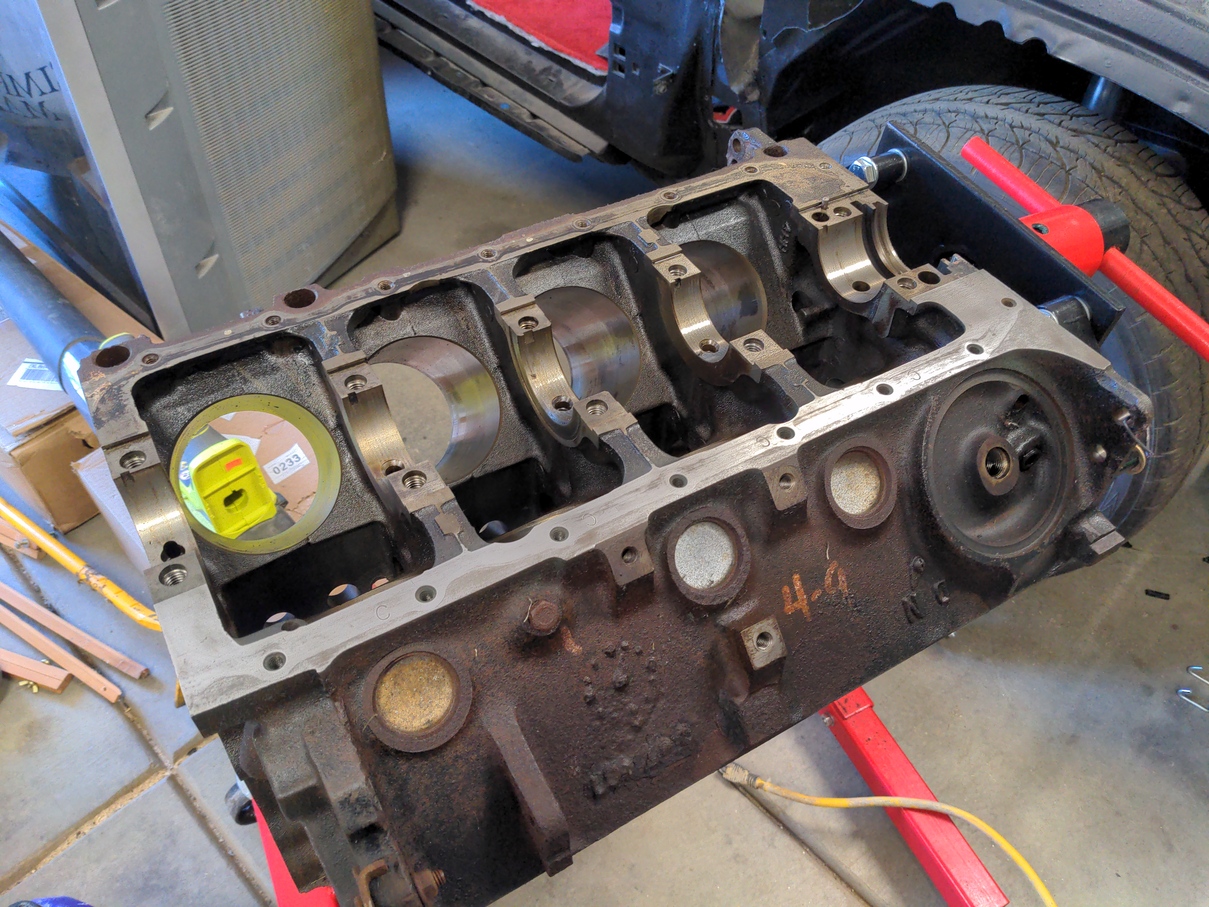 A V8 engine block, with the interior surfaces cleaned. The exterior is still quite rusty, but that will soon be covered by paint.