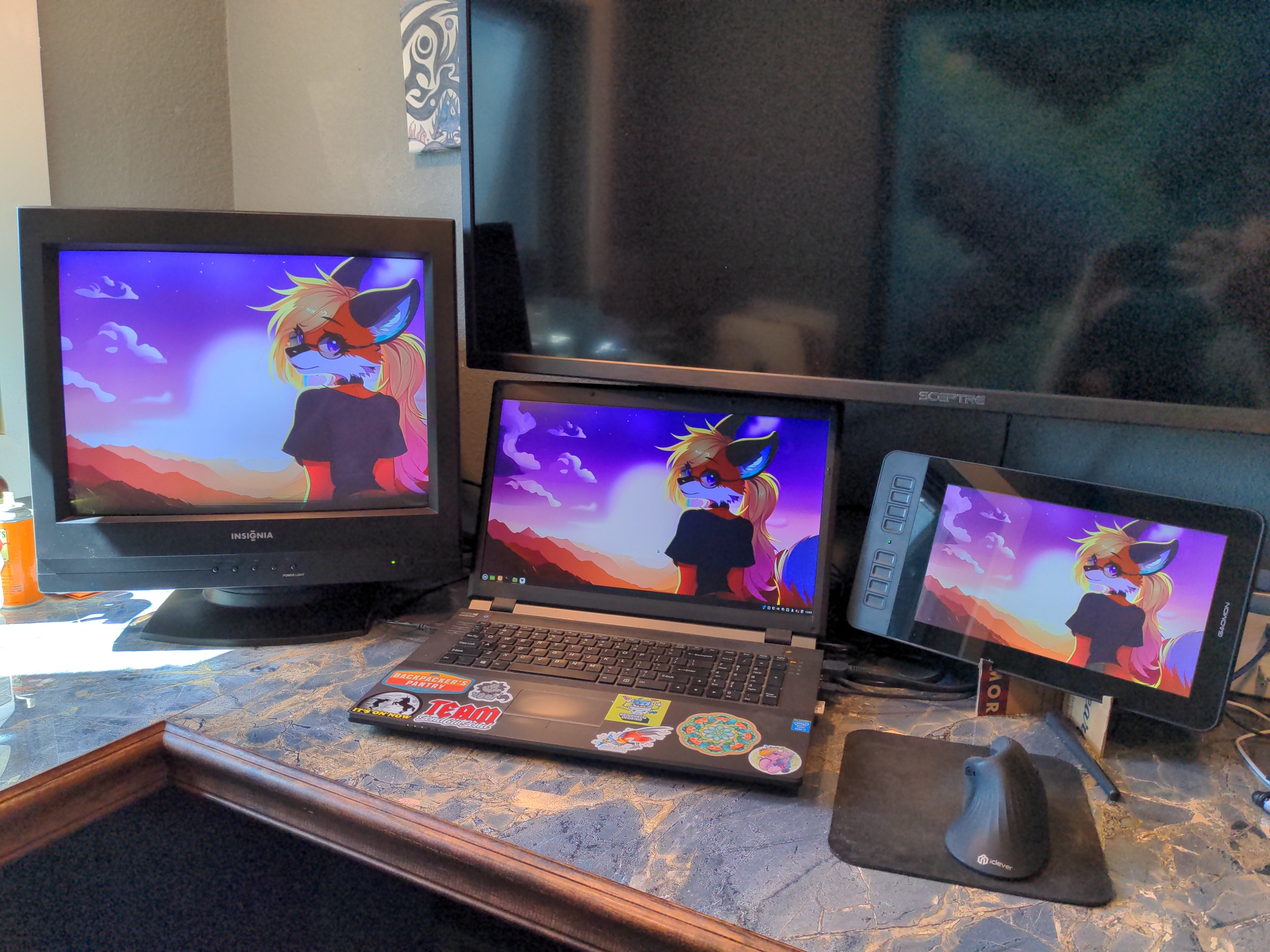 CRT monitor alongside an older laptop and a drawing tablet. Each screen is displaying the same background image; the monitor at 1600x1200, the laptop and tablet at 1920x1080. Some color differences are noticeable, and the montior has a small black area at the bottom due to the refresh rate syncing up poorly with the camera